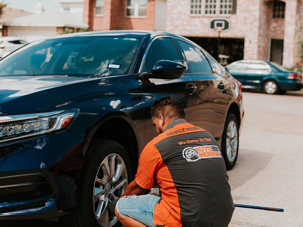 Auto Monkey mobile mechanic finishing up brake job